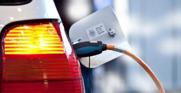Electric car plugged into EV charger after professional installation in Los Angeles, CA