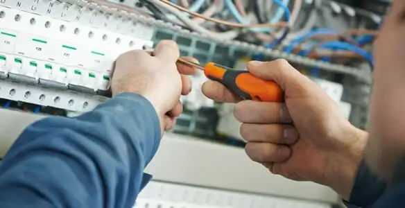 electrical service showing licensed electrician performing electrical panel maintenance and adjustments in Los Angeles, CA
