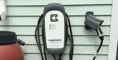 Outdoor electric vehicle charger installation on residential wall in Los Angeles, CA