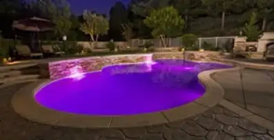 pool light installation and repair services illuminating a residential swimming pool in Los Angeles, CA