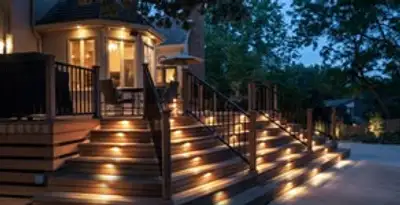 Residential electrician installing outdoor lighting for home safety in Los Angeles, CA