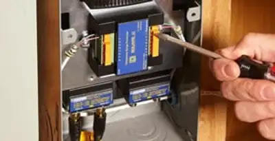 Whole home surge protection device being installed by a licensed electrician to protect electrical systems in Los Angeles, CA